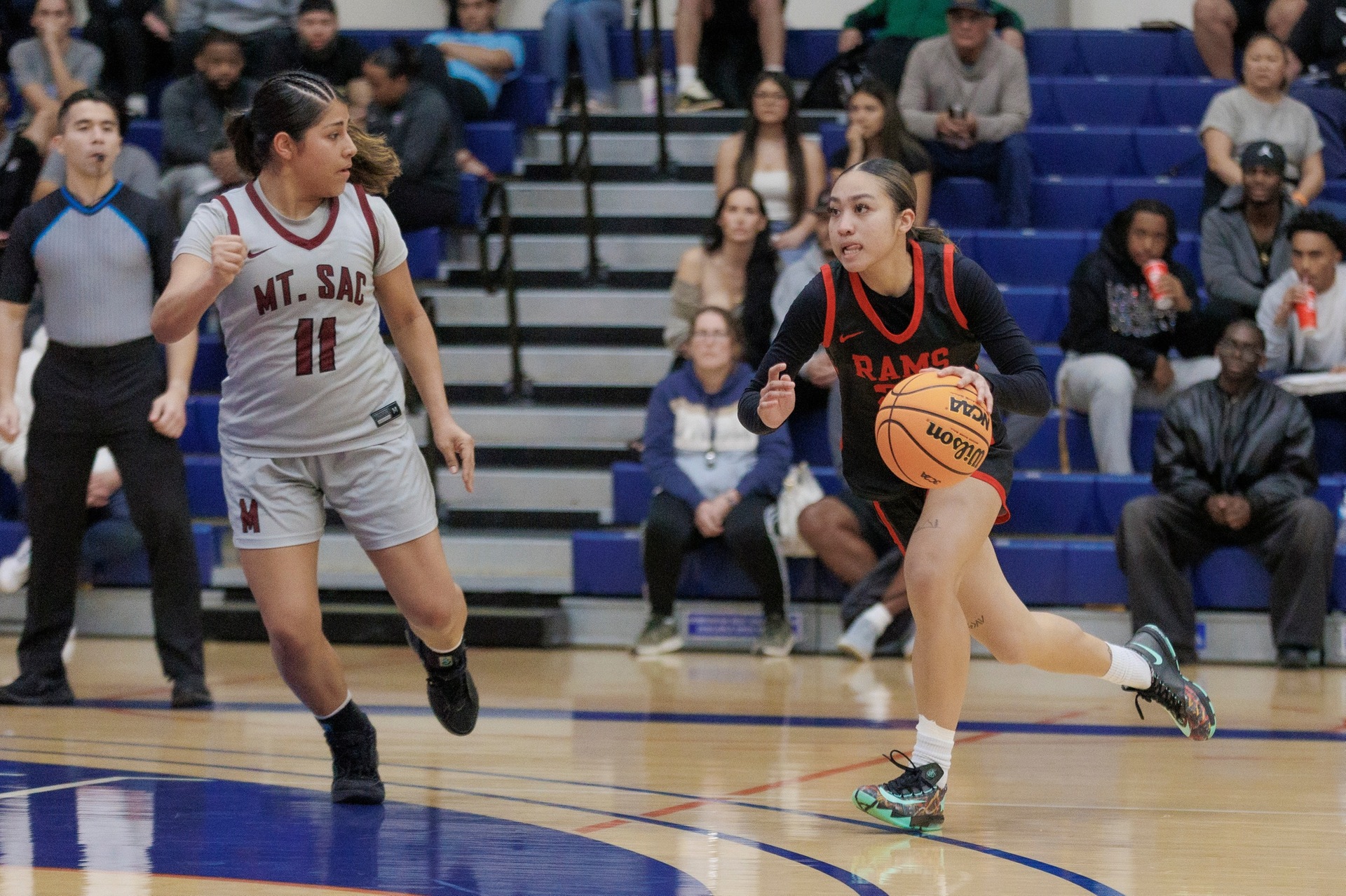 Alyssa Kem drives to the hoop as Fresno performs the upset quarterfinal win (photo/galleries by Chris Mora).